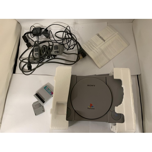 333 - A BOXED PLAYSTATION ONE TOGETHER WITH DUAL SHOCK CONTROLLER