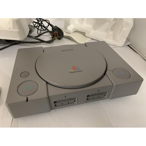 333 - A BOXED PLAYSTATION ONE TOGETHER WITH DUAL SHOCK CONTROLLER