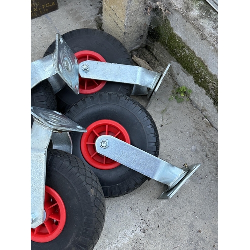 34 - FOUR LARGE RUBBER TROLLEY WHEELS NO VAT