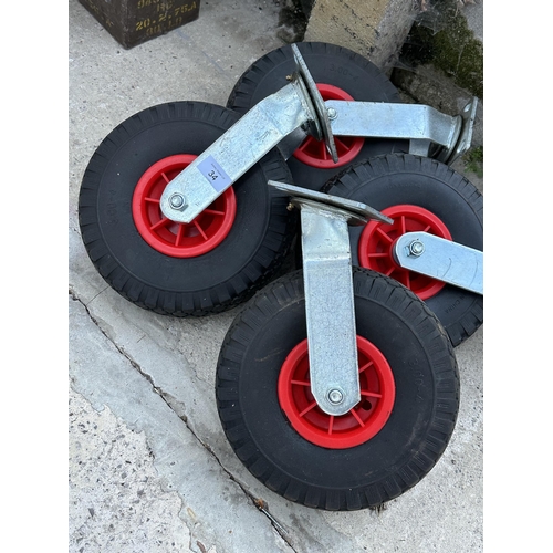 34 - FOUR LARGE RUBBER TROLLEY WHEELS NO VAT