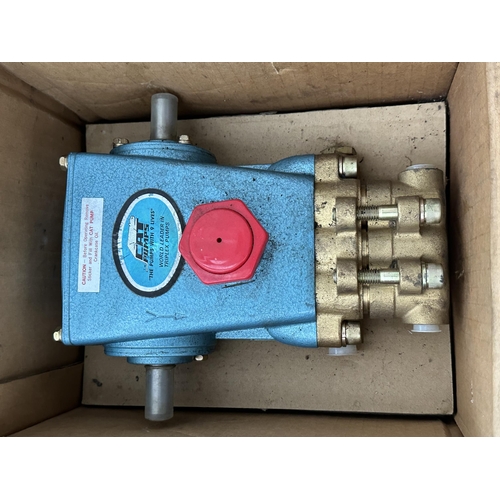 79 - AN AS NEW CAT PUMP AND A MOTOR NO VAT