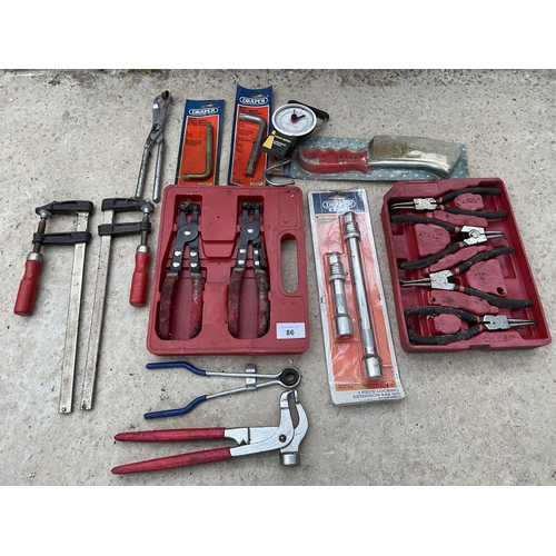 86 - AN ASSORTMENT OF TOOLS TO INCLUDE CLAMPS AND PLIERS ETC NO VAT