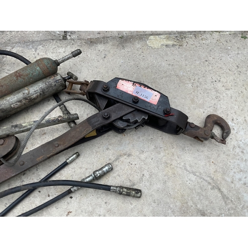 91 - AN ASSORTMENT OF ITEMS TO INCLUDE GREASE GUNS AND A WINCH ETC NO VAT