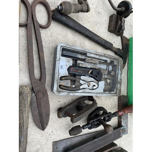 94 - AN ASSORTMENT OF TOOLS TO INCLUDE PLIERS, RASPS AND AN AXE ETC NO VAT