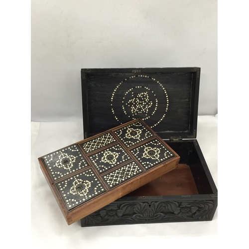 10 - A VINTAGE CARVED DARK OAK JEWELLERY BOX WITH INNER SECTION WITH INLAID COMPARTMENT LIDS