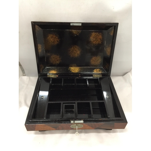 14 - AN ORIENTAL STYLE BLACK LACQUERED AND WOODEN JEWELLERY BOX WITH KEY