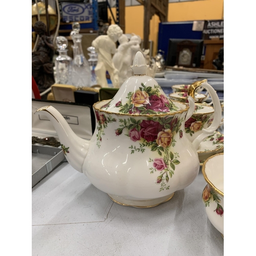 162 - A ROYAL ALBERT OLD COUNTRY ROSES TEA SET COMPRISING TEAPOT, CUPS SAUCERS ETC