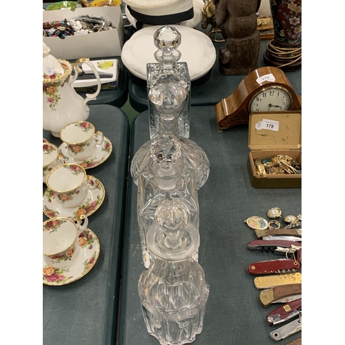 180 - A GROUP OF FOUR CUT GLASS DECANTERS