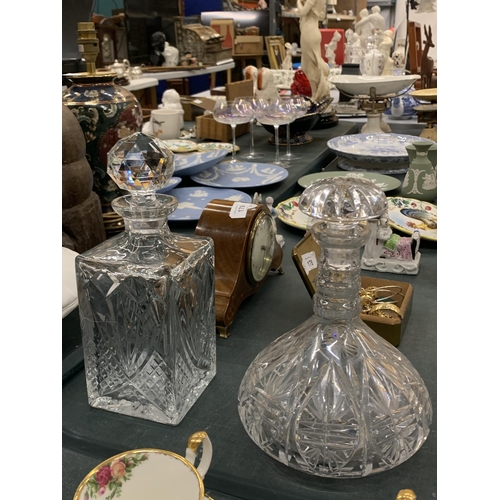 180 - A GROUP OF FOUR CUT GLASS DECANTERS