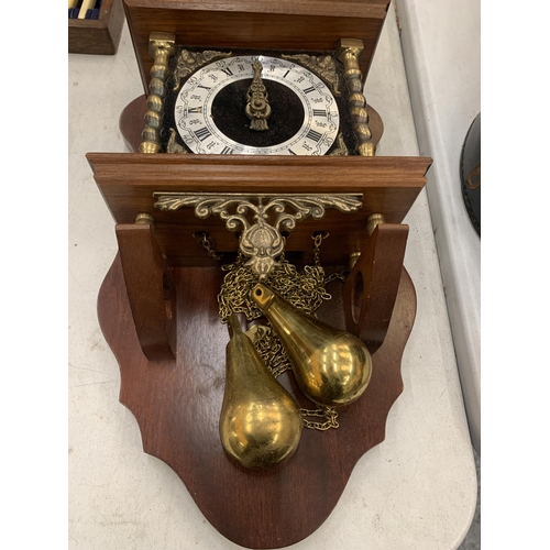 203 - A SWISS WALL CLOCK WITH BRASS WEIGHTS