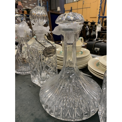 206A - A GROUP OF FOUR CUT GLASS DECANTERS TO INCLUDE ROYAL DOULTON EXAMPLE AND SILVER PLATED DECANTER LABE... 