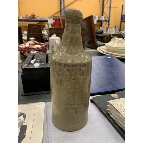 219 - A VINTAGE J HEGINVBOTHAM, STALEY BRIDGE STONEWARE BOTTLE