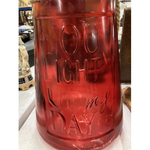 235 - A LARGE RED GLASS YOU LIGHT UP MY DAY URN