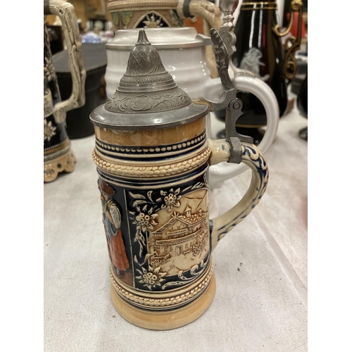 236A - A COLLECTION OF VINTAGE GERMAN BEER STEINS WITH MUSICAL EXAMPLE