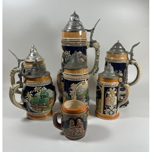 101 - A COLLECTION OF SEVEN VINTAGE GERMAN BEER STEINS, LARGEST 28 CM