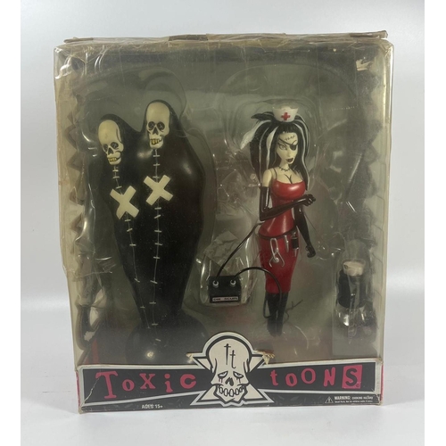 A 2004 MEZCO BOXED TOXIC TOONS THE BODY BAG BROTHERS AND MISS CERY GOTHIC  FIGURES, 28 X 23 CM