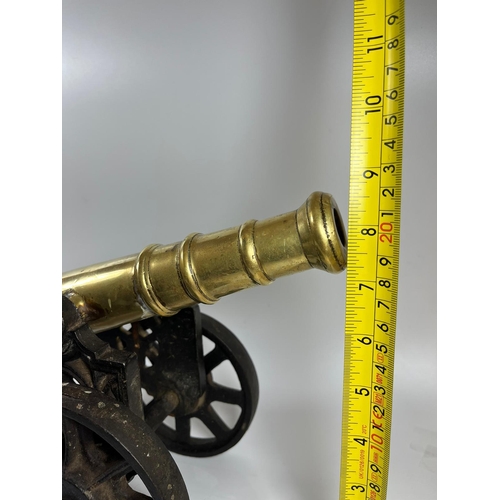 300A - A PAIR OF HEAVY CAST IRON AND SOLID BRASS VINTAGE CANNONS, LENGTH 47 CM