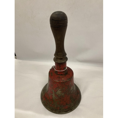 115 - A LARGE VINTAGE METAL BELL WITH A WOODEN HANDLE