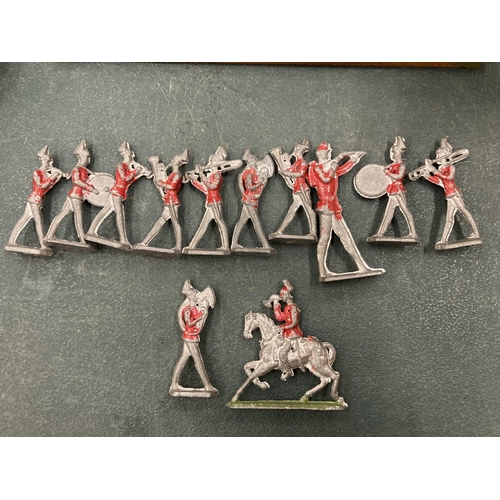 129 - A VINTAGE 12 PIECE LEAD REDCOAT BRASS BAND