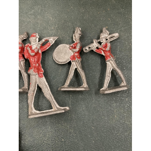 129 - A VINTAGE 12 PIECE LEAD REDCOAT BRASS BAND