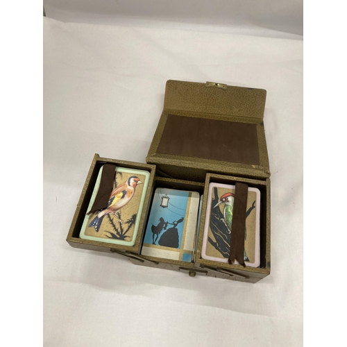 141 - A VINTAGE LEATHER PLAYING CARD BOX WITH PLAYING CARDS