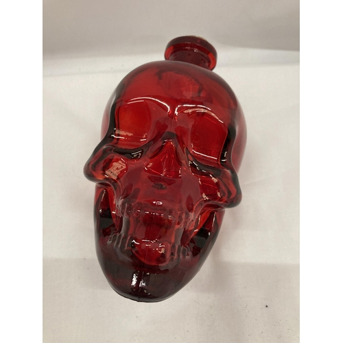 145 - A RED DOUBLE THICKNESS GLASS DECANTER, HEIGHT 16CM