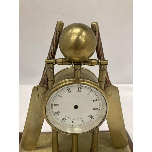 298A - A BRASS MANTLE CLOCK FASHIONED AS CRICKET BATS, STUMPS AND BALL -A/F NO MOVEMENT HEIGHT 22CM