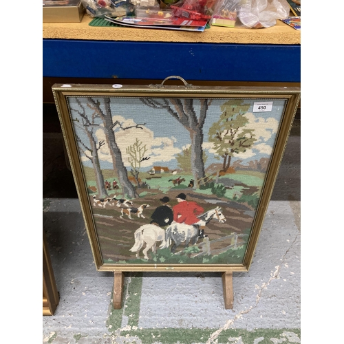 450 - A VINTAGE FIRE SCREEN WITH A TAPESTRY HUNT SCENE WITH A WOODEN AND METAL FRAME, 49CM X 68CM