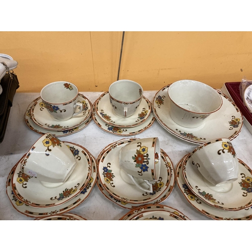 461 - A VINTAGE PALISSY TEASET WITH FLORAL PATTERN ON A CREAM BACKGROUND TO INCLUDE CAKE PLATES, SUGAR BOW... 