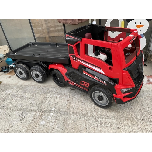 A 'SUPER CAR' BATTERY POWERED CHILDS RIDE ALONG BATTERY WAGON AND