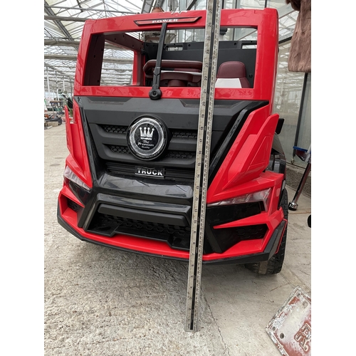 A 'SUPER CAR' BATTERY POWERED CHILDS RIDE ALONG BATTERY WAGON AND