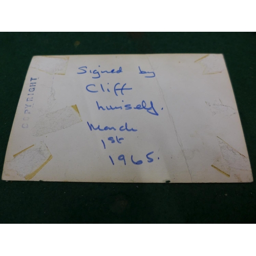 14 - A CLIFF RICHARD SIGNED PHOTOGRAPH, VERSO 'SIGNED BY CLIFF RICHARD MARCH 1ST 1965'