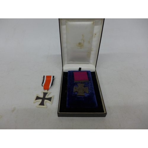 403 - A CASED REPLICA VICTORIA CROSS AND A REPLICA IRON CROSS