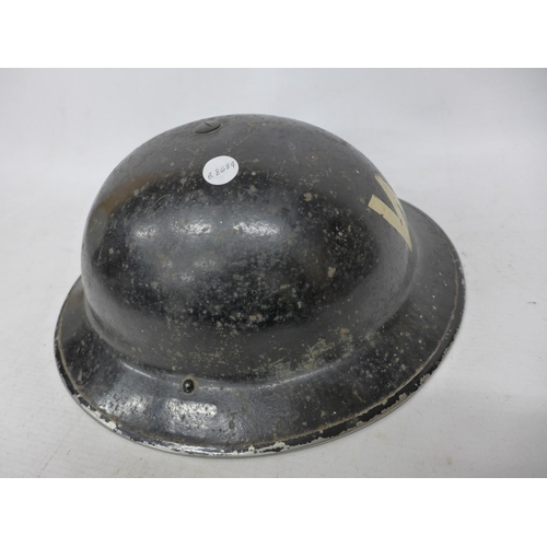 414 - A WORLD WAR II BRITISH AIR RAID WARDENS BLACK PAINTED HELMET WITH LINER