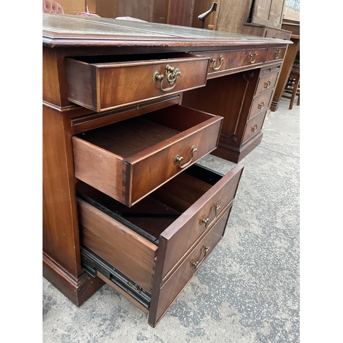 2802 - A 19TH CENTURY STYLE PARTNERS DESK ENCLOSING EIGHT DRAWERS, FILING DRAW, TWO SLIDES AND TWO SHAM DRA... 