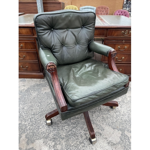 2803 - A 19TH CENTURY STYLE SWIVEL AND ADJUSTABLE DESK CHAIR IN GREEN LEATHER WITH BUTTON-BACK