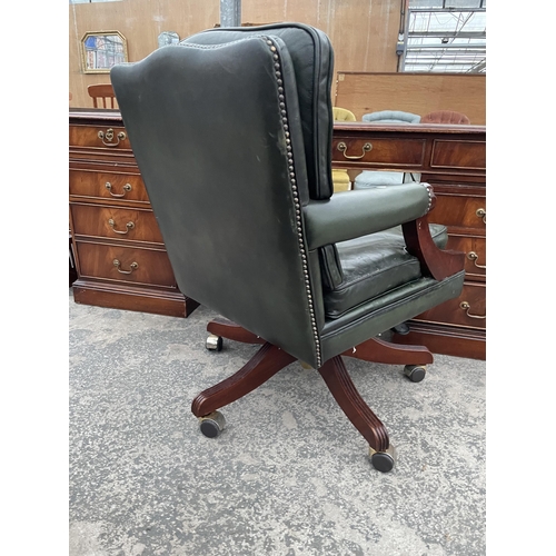 2803 - A 19TH CENTURY STYLE SWIVEL AND ADJUSTABLE DESK CHAIR IN GREEN LEATHER WITH BUTTON-BACK