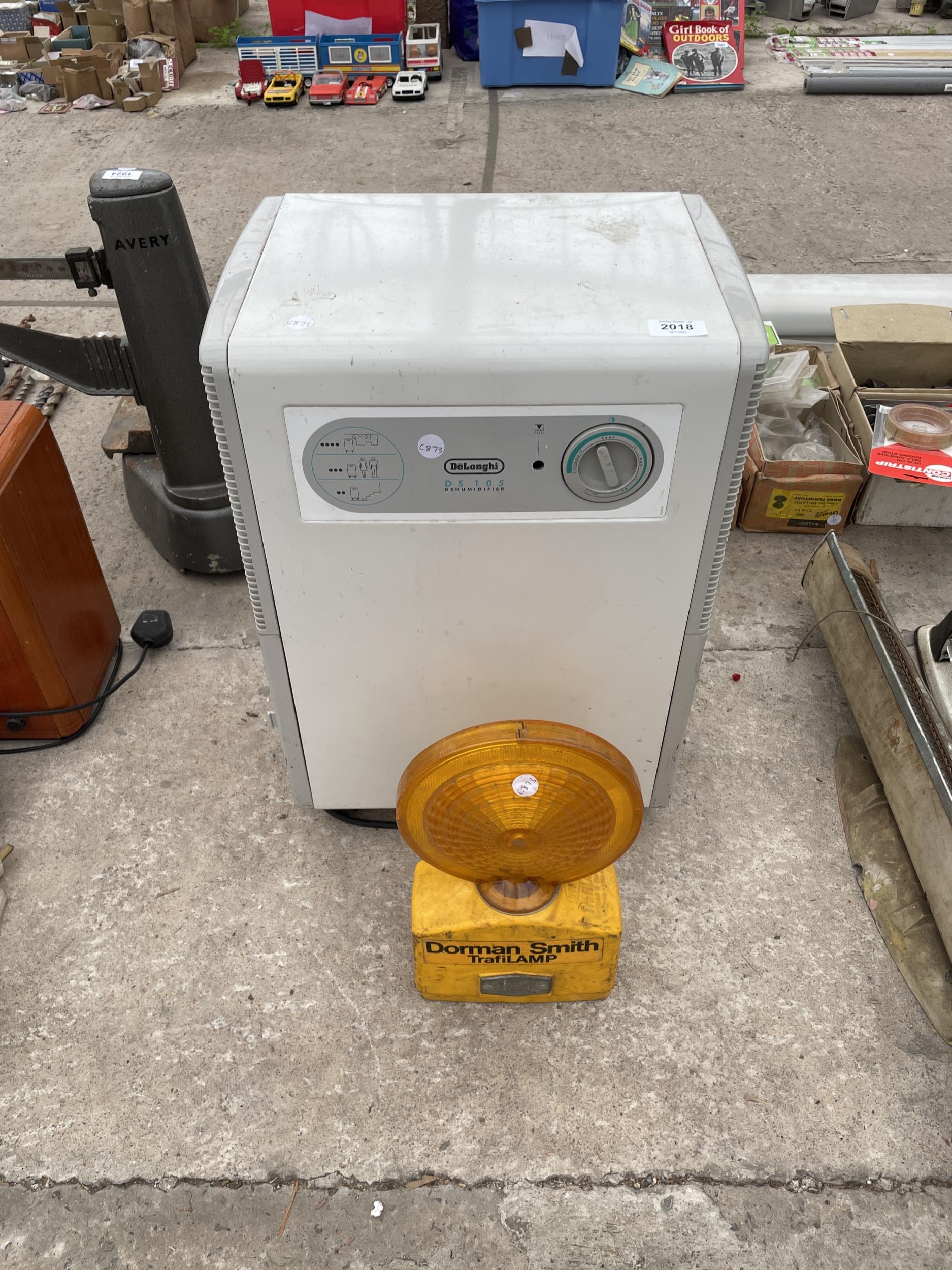 A DELONGHI DEHUMIDIFIER AND A ROAD LIGHT