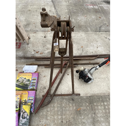 2051 - A PIPE BENDER ON STAND AND AN ASSORTMENT OF CROW BARS