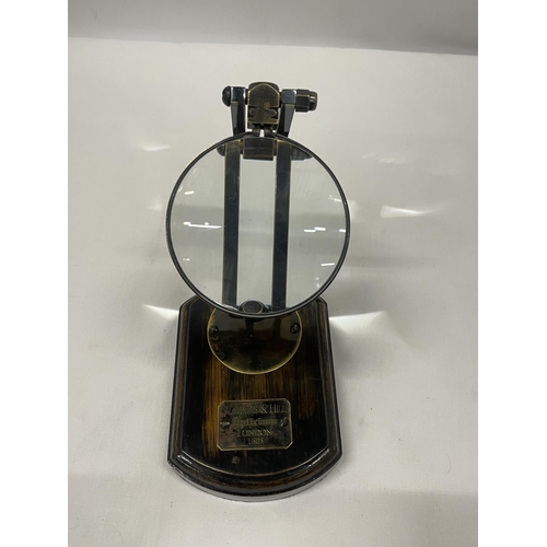 45 - A WATKINS AND HILL MAGNIFYING GLASS ON WOODEN BASE