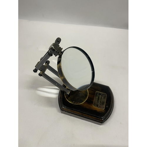 45 - A WATKINS AND HILL MAGNIFYING GLASS ON WOODEN BASE