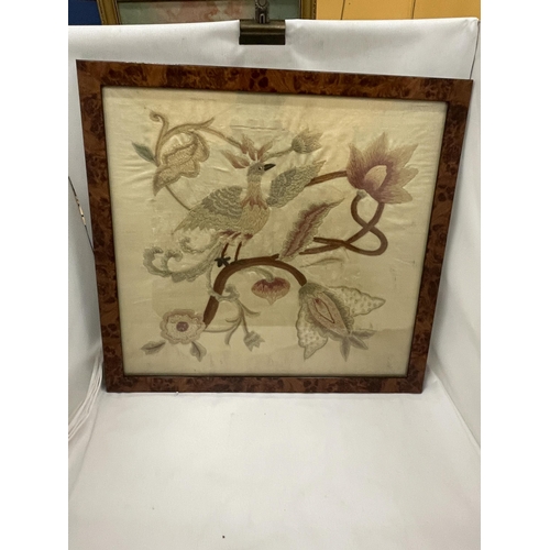 47 - A WALNUT FRAMED VINTAGE SILK EMBROIDERY OF A BIRD AMONGST FLOWERS