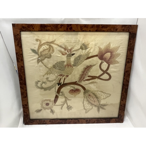 47 - A WALNUT FRAMED VINTAGE SILK EMBROIDERY OF A BIRD AMONGST FLOWERS