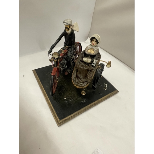 81 - AN UNUSUAL SCULPTURE OF A MAN AND WOMAN ON A MOTORBIKE WITH SIDE CAR, INDISTINCTLY SIGNED, POSSIBLY ... 