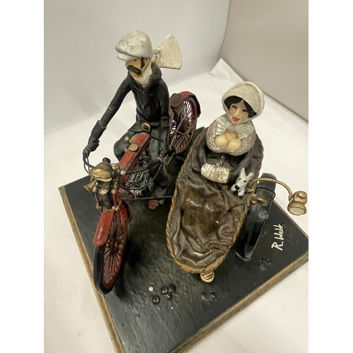 81 - AN UNUSUAL SCULPTURE OF A MAN AND WOMAN ON A MOTORBIKE WITH SIDE CAR, INDISTINCTLY SIGNED, POSSIBLY ... 