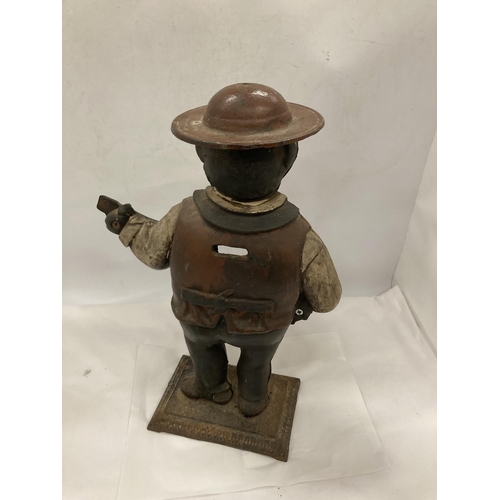 98 - A VINTAGE CAST METAL FIGURE OF A MAN PLAYING THE GUITAR