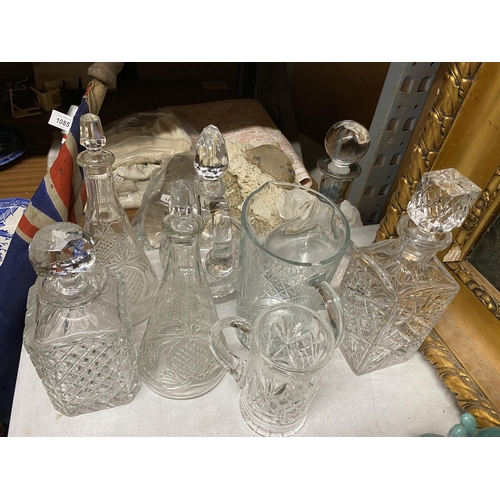 1082 - A MIXED LOT OF GLASSWARE TO INCLUDE DECANTERS ETC