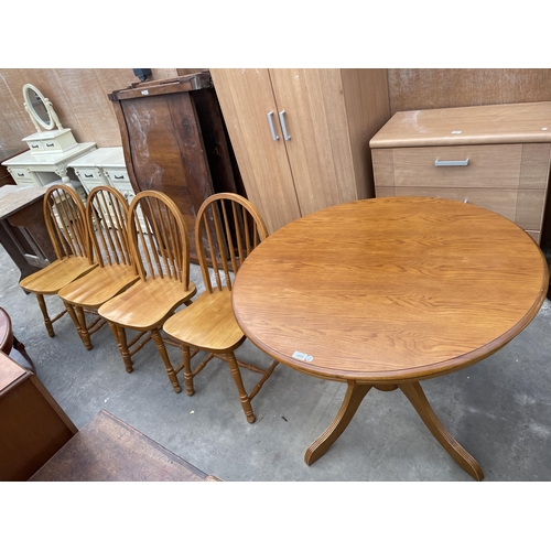 3055 - A CIRCULAR PINE DINING TABLE AND FOUR MATCHING CHAIRS