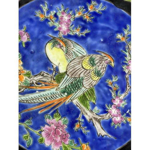 119 - A 1960S JAPANESE BIRD DESIGN BLUE POTTERY PLATE, DIAMETER 22 CM