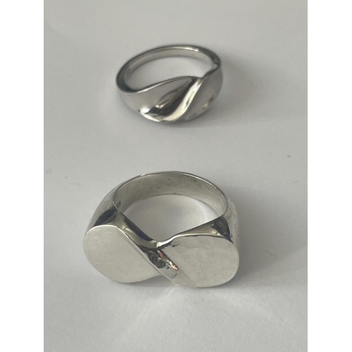 521 - FOUR ASSORTED SILVER RINGS